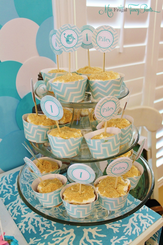 Little Mermaid Under the Sea 1st Birthday Party Decor with Aqua Cupcake Wrappers & Toppers| missfrugalfancypants.com